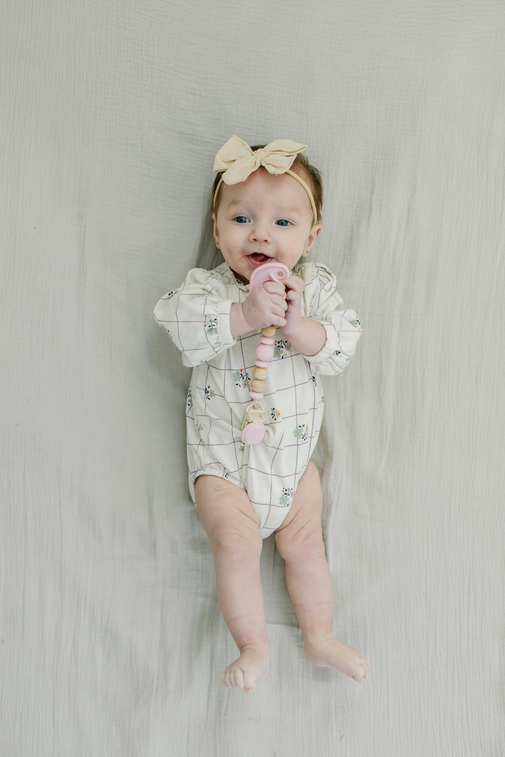 Mila & Lulu soft silicone cord keeps pacifier handy without snagging.