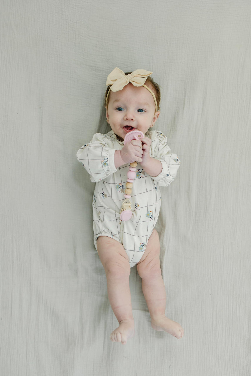 Mila & Lulu soft silicone cord keeps pacifier handy without snagging.