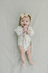 Mila & Lulu soft silicone cord keeps pacifier handy without snagging.