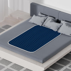 MILDPLUS reusable bed pad shown as machine washable for eco-friendly protection.