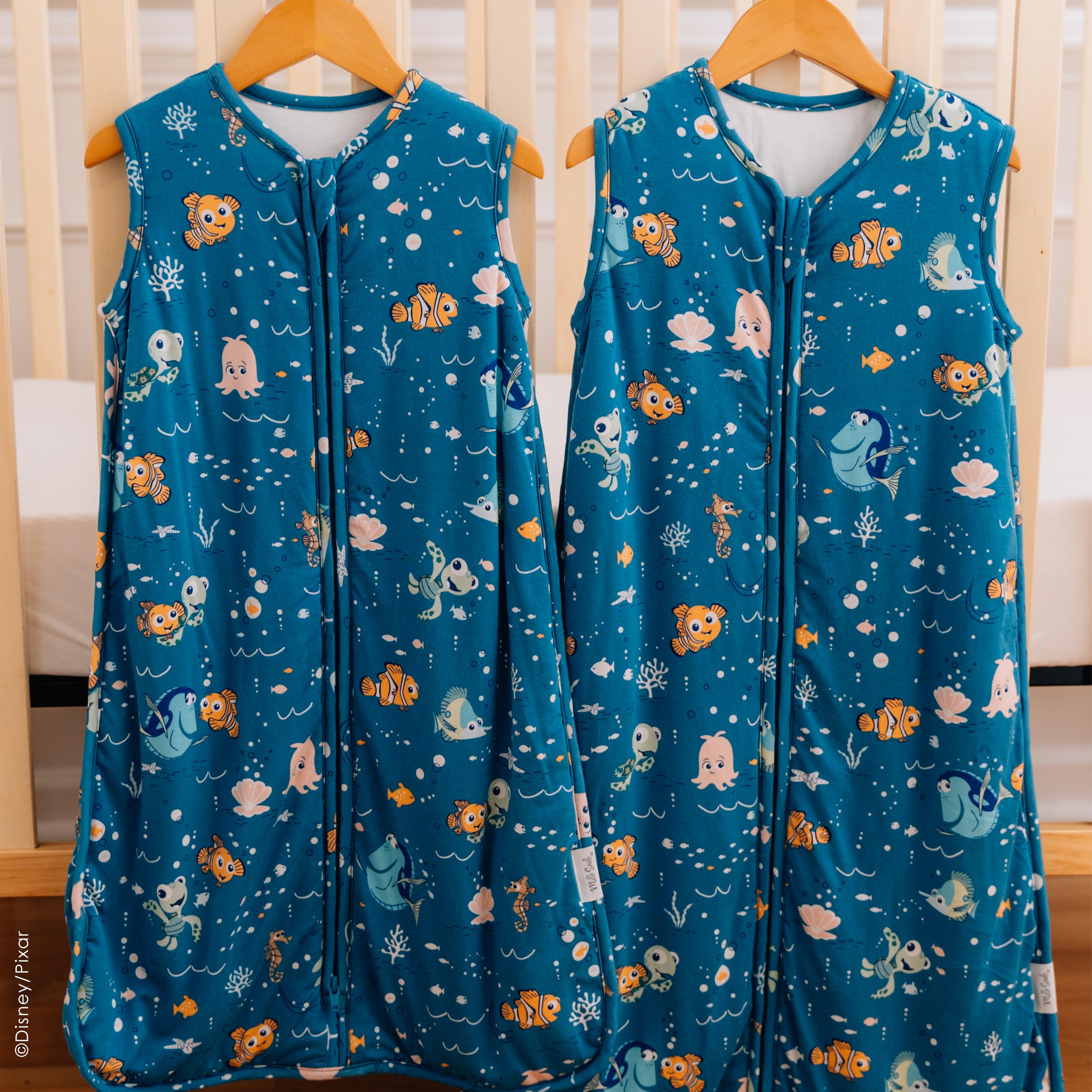 Milk Snob Disney sleeping sack Nemo nap-time setup on crib