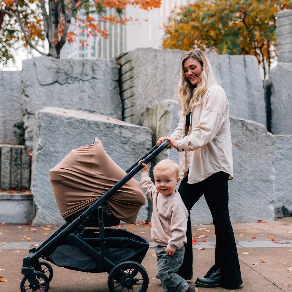 Milk Snob Luxe Nursing Cover used as a lounger canopy for privacy.