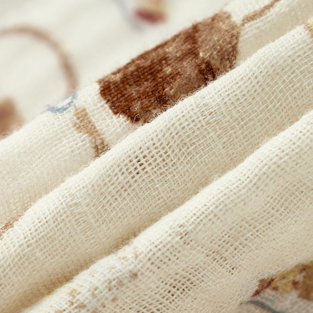 Milkbarn baby swaddle in a nursery setting