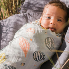 Milkbarn Homestead blanket laid in crib showcasing generous 47 by 47 inches