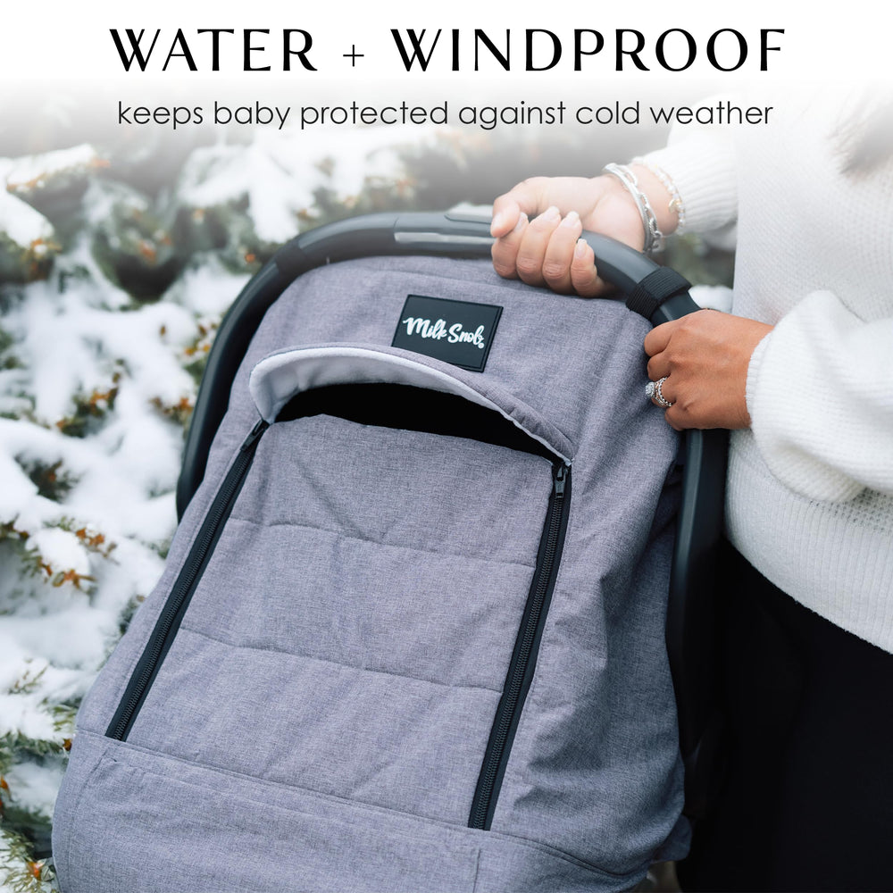 Milk Snob Winter Car Seat Cover bottom clasp secures the cover on car seats.