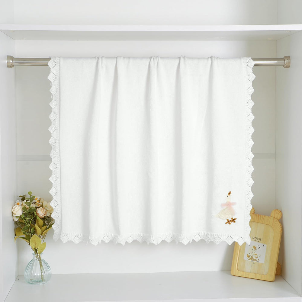 mimixiong blanket shown for swaddle use with snug wrap