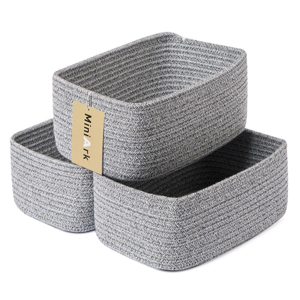 MiniArk small storage baskets organize cosmetics and keys on a dresser.