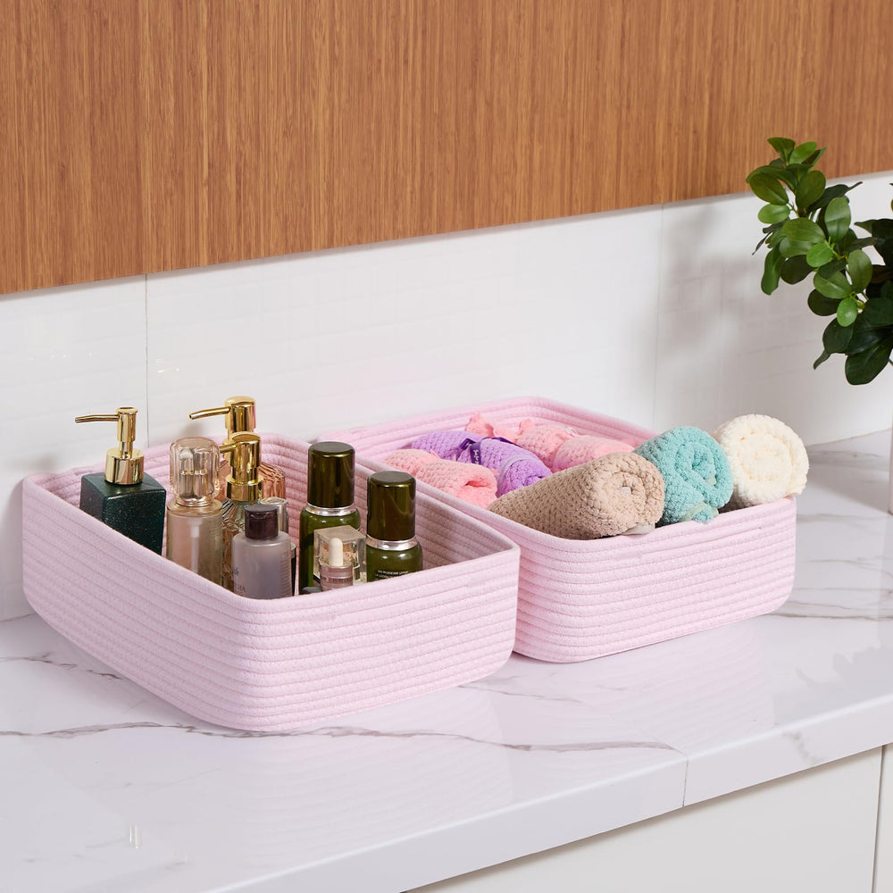 MiniArk fold-flat storage baskets in light pink for compact storage when not in use.
