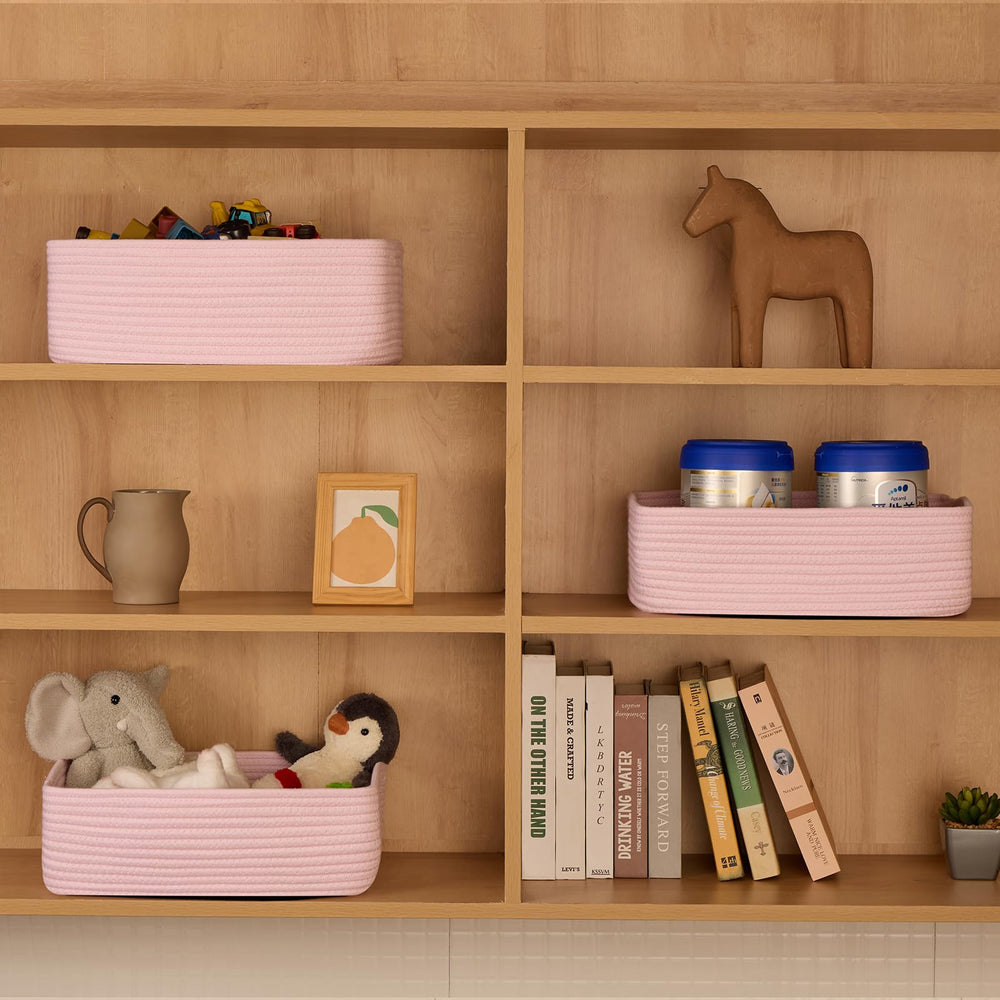 MiniArk large shallow baskets rose pink beside a dresser for bedroom storage