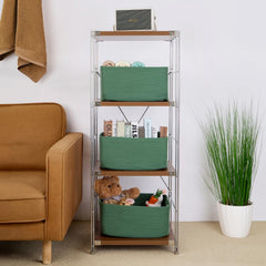 MiniArk large storage baskets in green — filled with clothes for ample capacity.