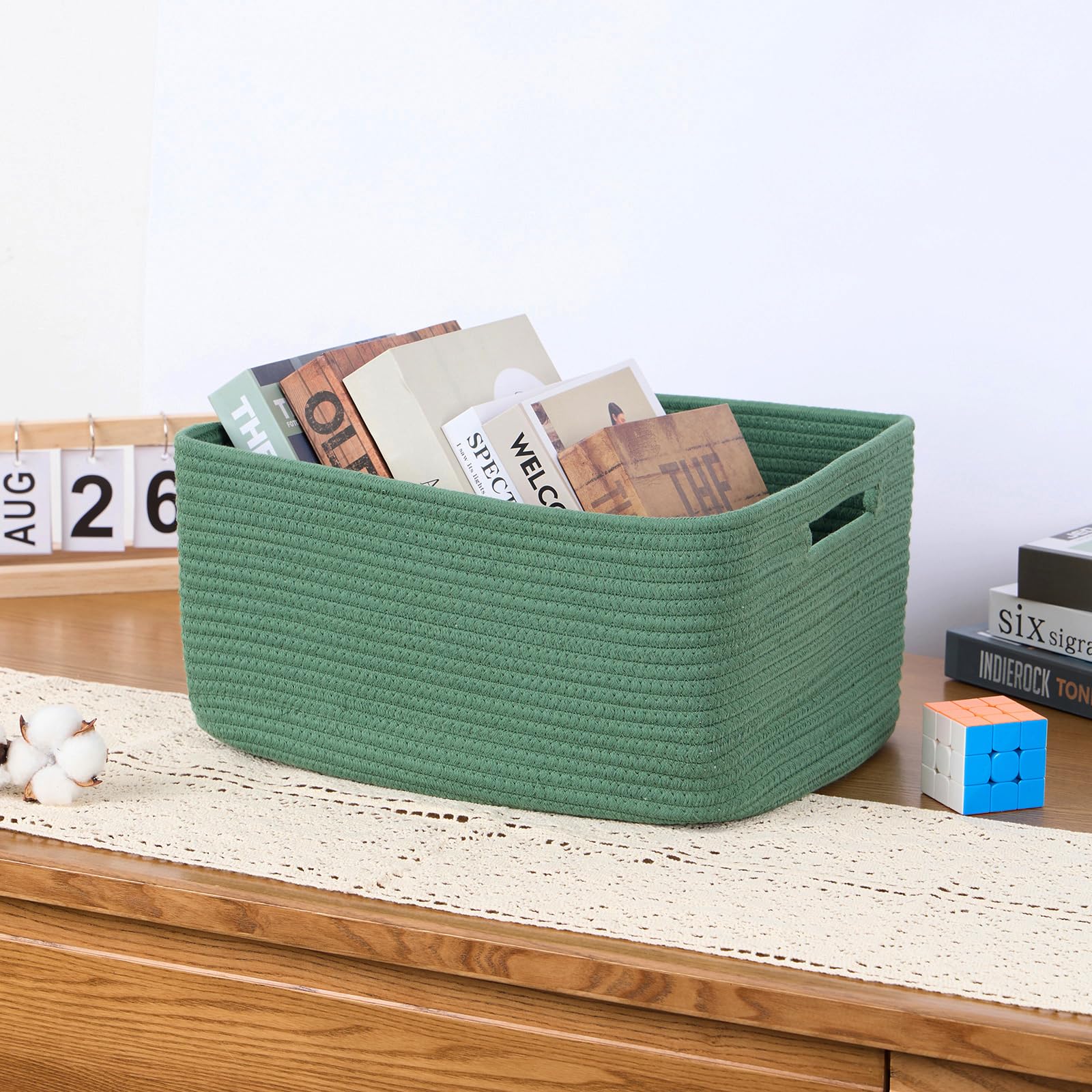 MiniArk large storage baskets in green — placed in nursery for baby item storage.