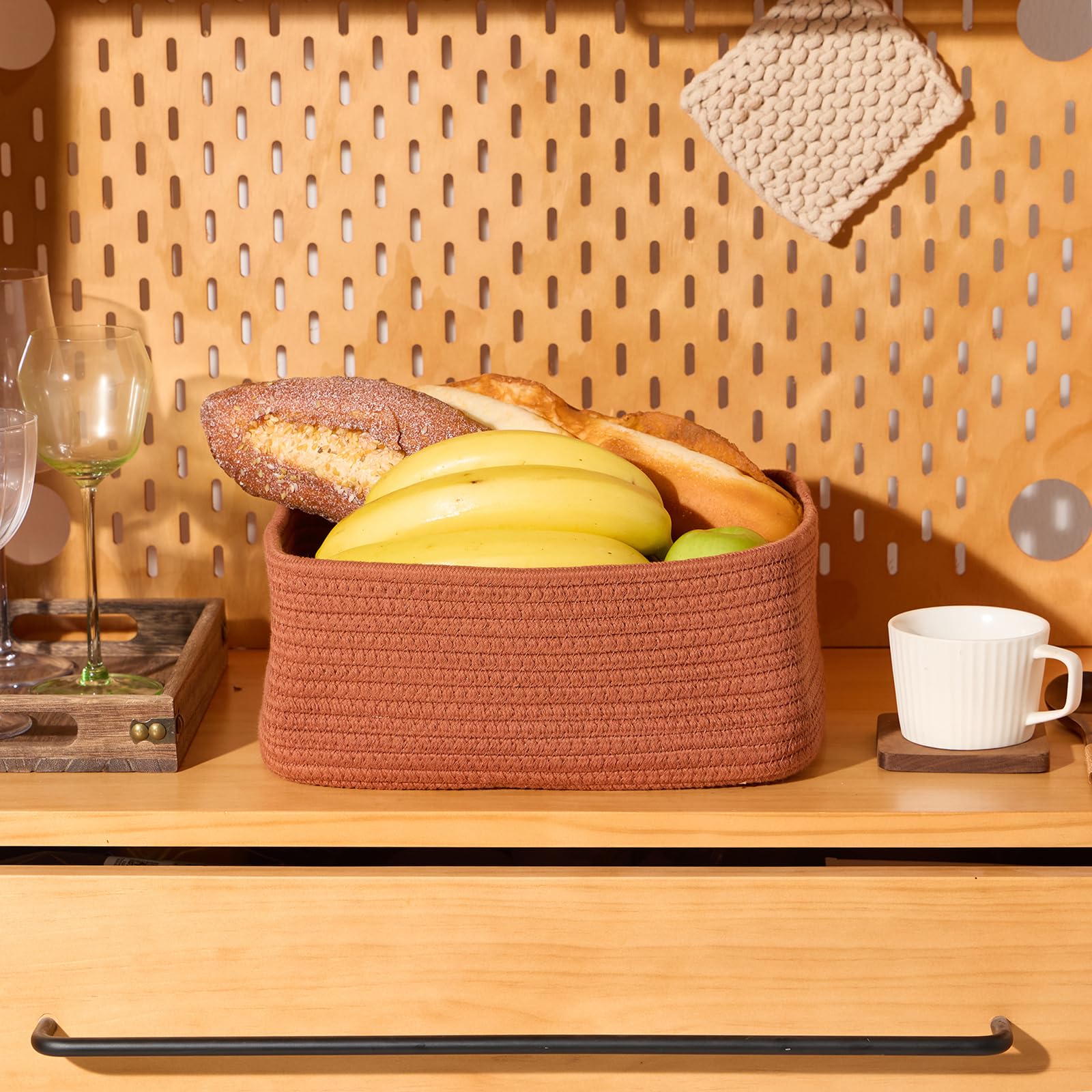 MiniArk oxide red baskets in nursery for easy diaper and toy organization.