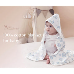 Minicoco receiving blanket pack shown in nursery use as a burp cloth.