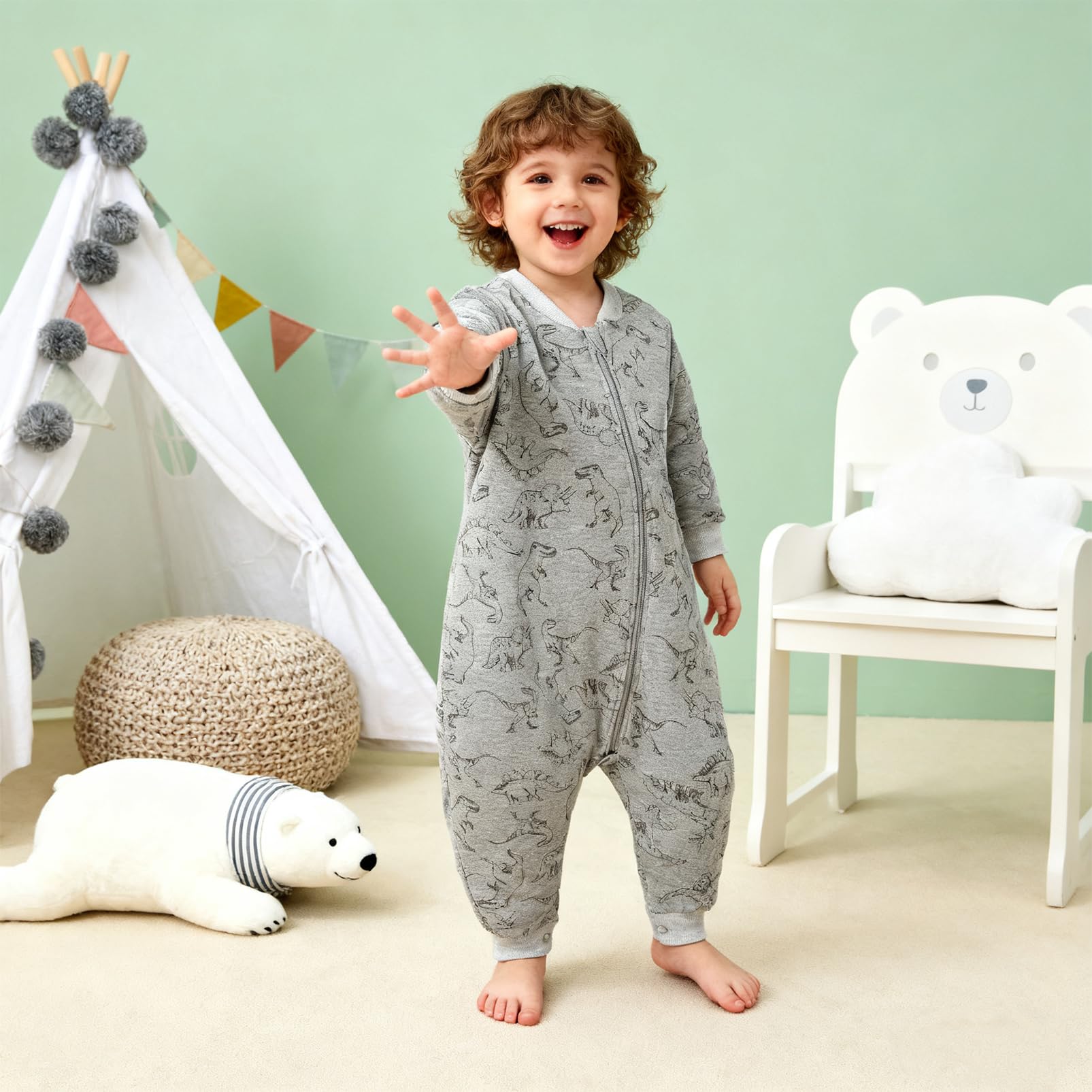 Minicoco footie-design blanket keeps arms and feet cozy.
