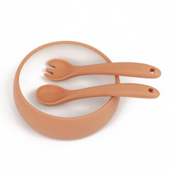 Miniguysa silicone utensils designed for tiny hands encourage independent eating.