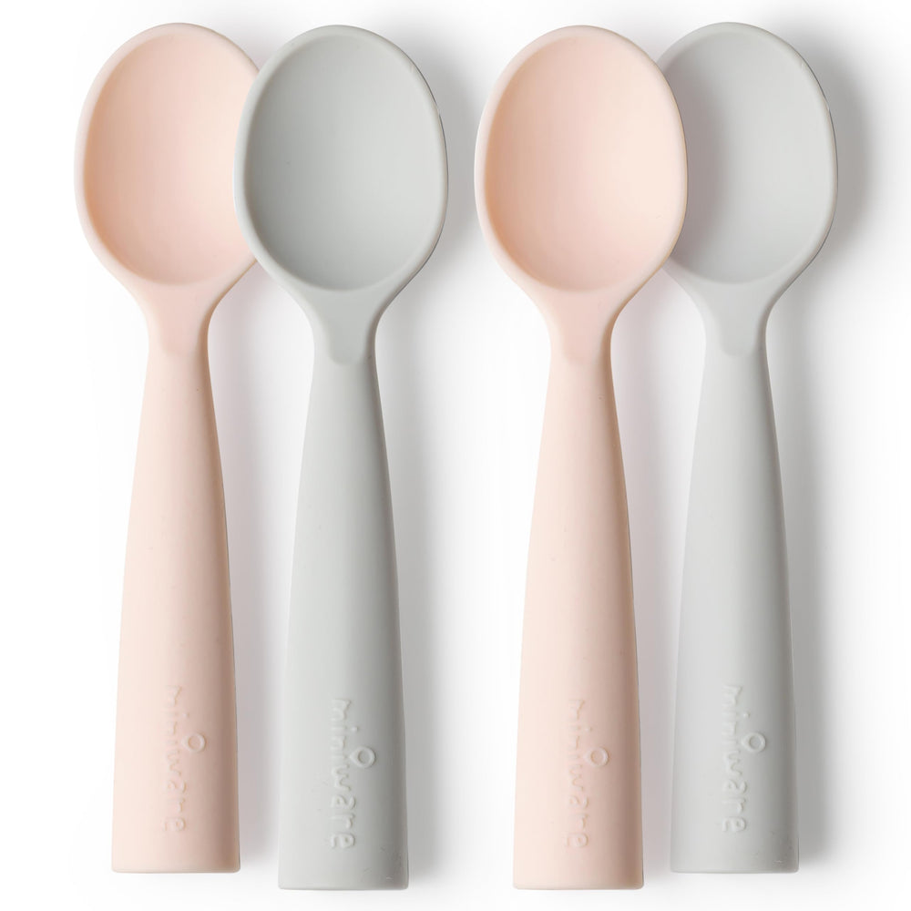 Miniware training spoons in grey and peach for self-feeding practice and gum-friendly use.