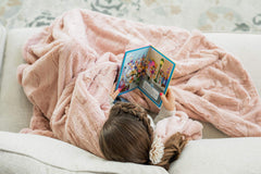 Minky Couture Sorbet Blanket on a bedside table, providing gentle warmth.