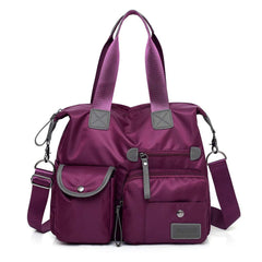 MINTEGRA nylon tote with front pockets keeps daily essentials organized on the go.