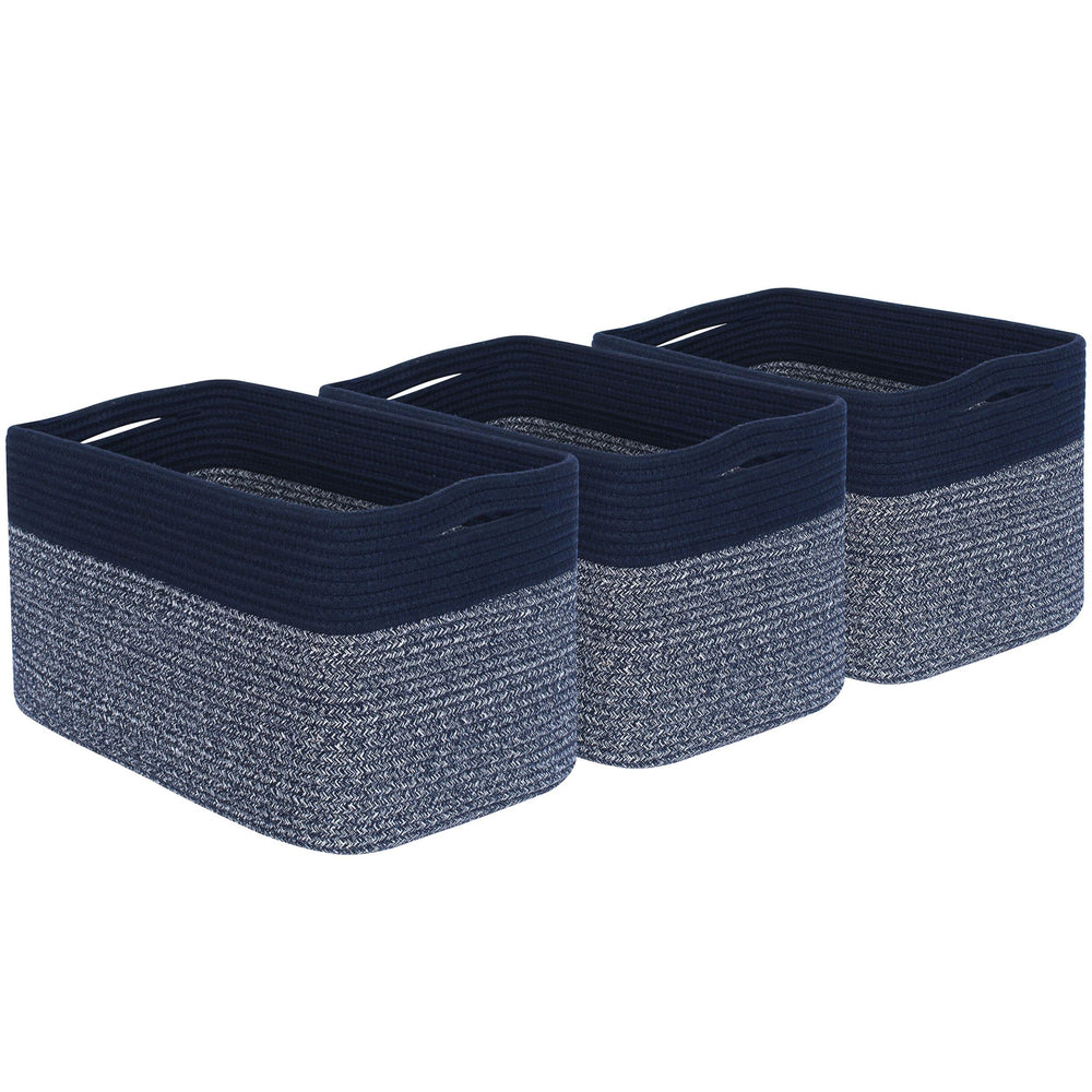 Mintwood Design navy blue baskets in a nursery near a nightstand.