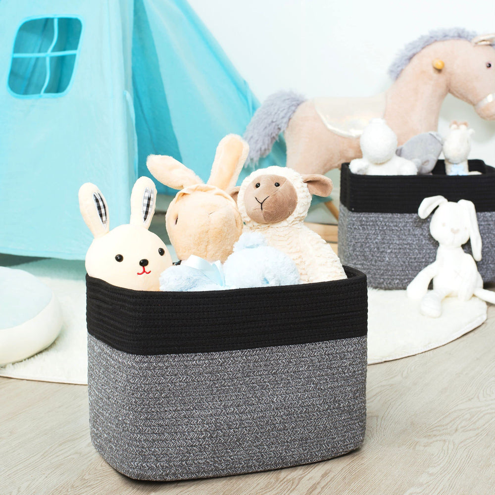 Mintwood Design baskets beside nursery table to store pacifiers, toys, and textiles
