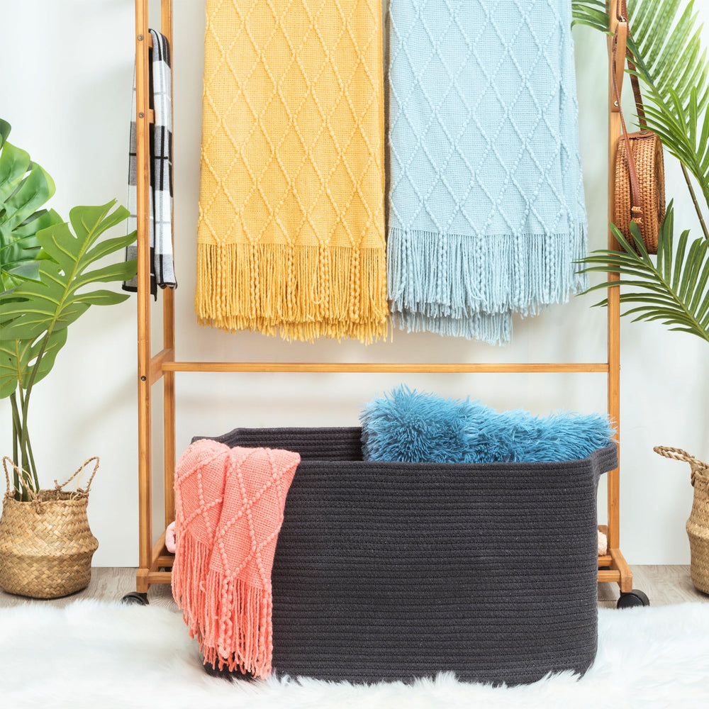 MINTWOOD Design basket with handles shown as laundry and towel storage.