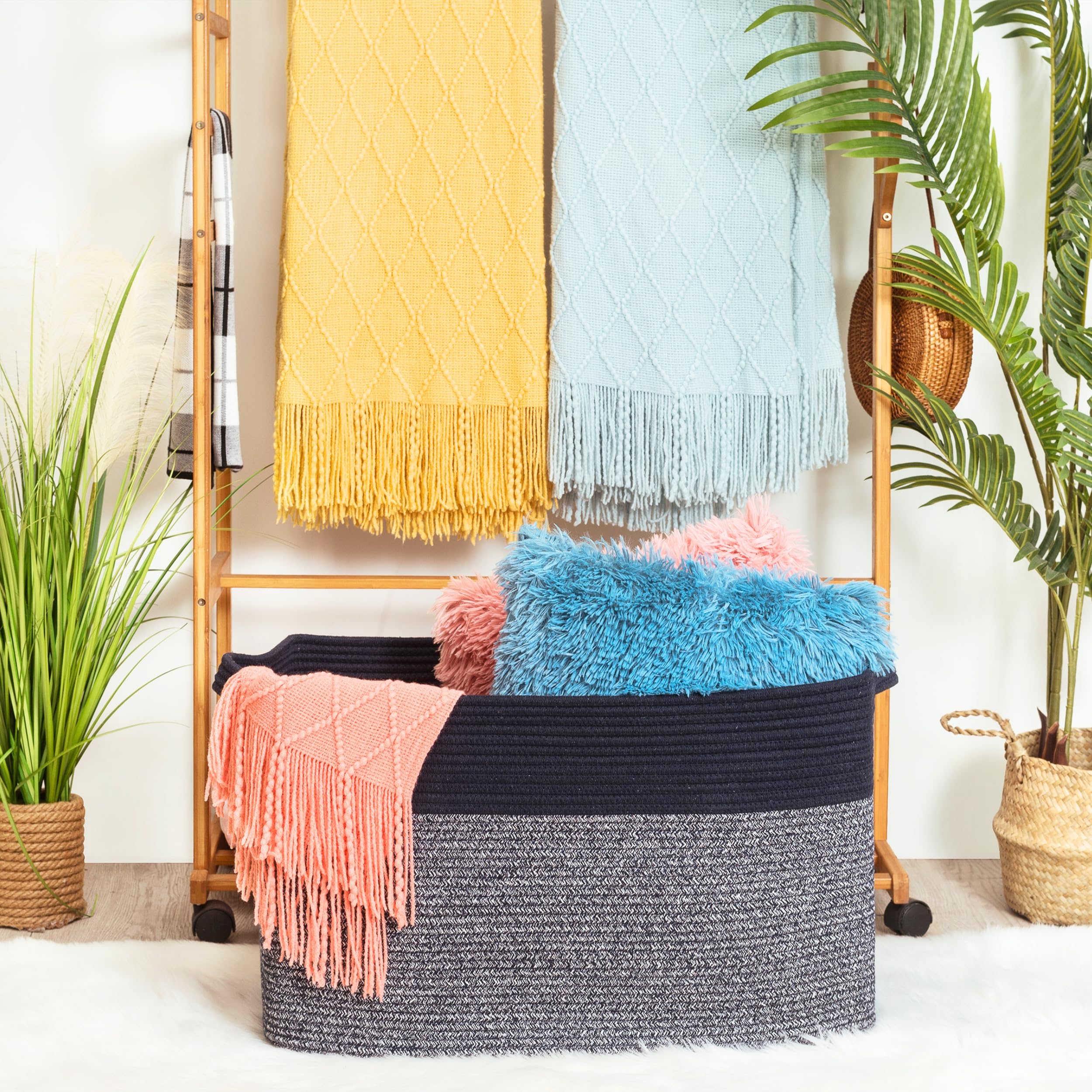 Mintwood Design rope basket with sturdy handles demonstrates easy transport around the home.