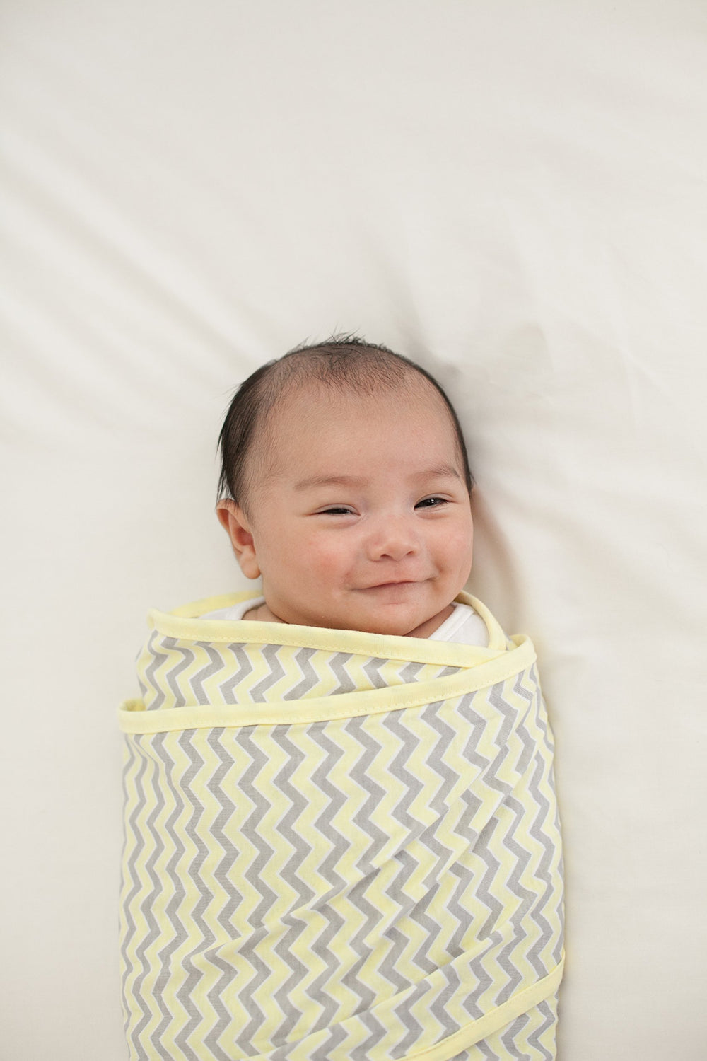 Miracle Blanket swaddle wrap arm-hug design provides secure, calming wrap.