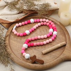Misdary baby rosary with pink silicone beads offers a soft, safe sensory toy.