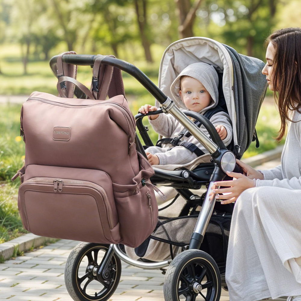 Miss Fong diaper bag backpack easy one-hand access for essentials on the go.