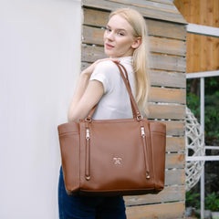 Miss Fong leather diaper bag tote main compartment for organized baby gear.