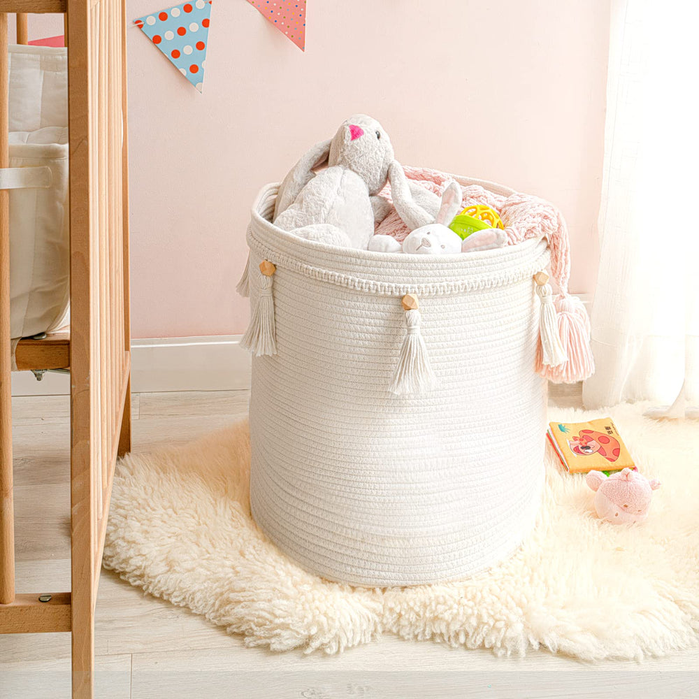 Mkono macrame basket stores toys and books for organized living spaces.