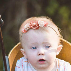 mligril baby headband floral bow close-up, showing stretchable elastic fit.