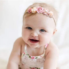 mligril floral headband on a newborn girl, color-safe fabric.
