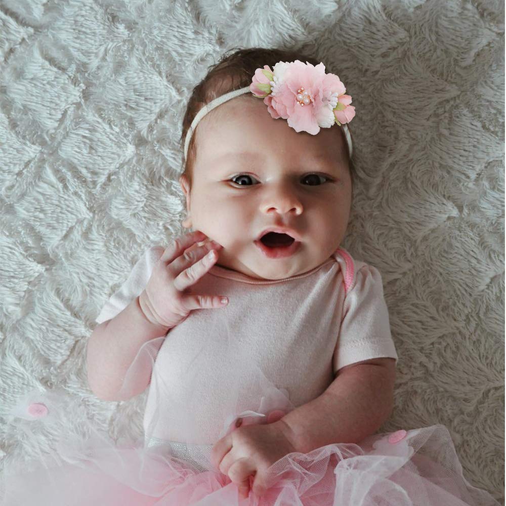 mligril headbands shown on a smiling baby to illustrate fit