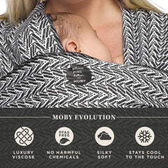 Moby Evolution Wrap demonstrates 8-33 lbs growth range with a small infant.
