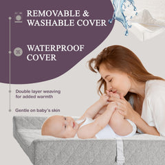 Modera adjustable safety strap keeps baby snug during changes.