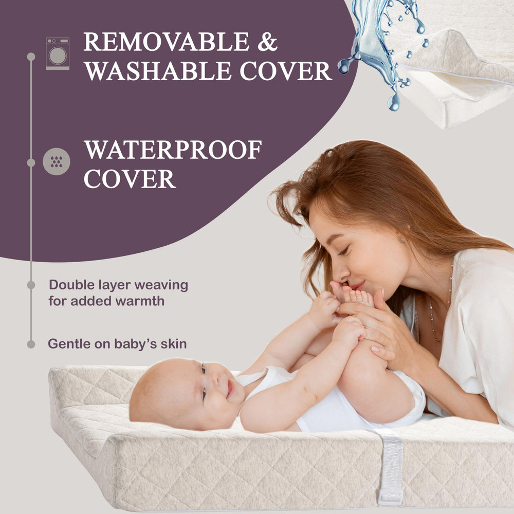 Modera built-in safety strap helps keep newborn snug during diapering