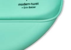 Modern Twist Bucket Bib is dishwasher-safe for quick cleaning.