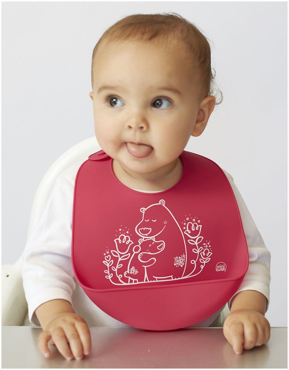 Modern-Twist silicone baby bib folded for compact storage and travel.