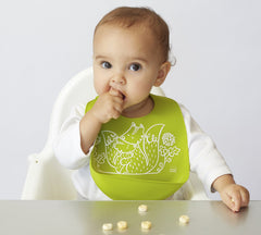 Modern-Twist silicone bib is adjustable for growing toddlers during meals.