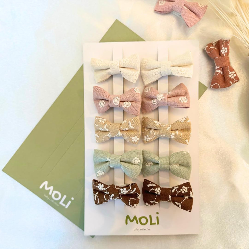 MoLi Baby Collection soft brown bow clip, gentle hold for delicate baby hair