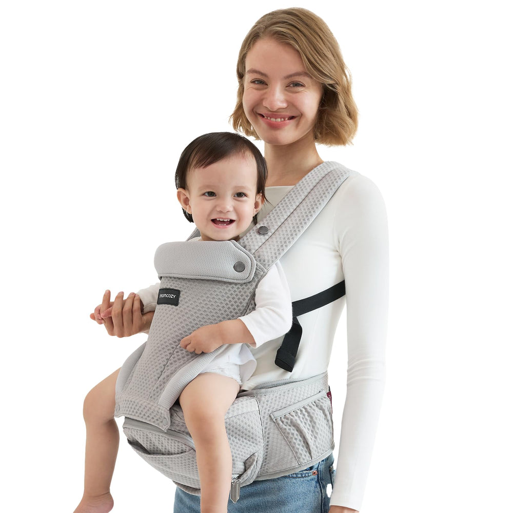 Momcozy baby carrier with hip seat—ergonomic alignment for comfortable hip support during outdoor walks.