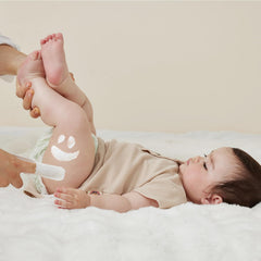 Momcozy diaper cream spatula for even spreading with care.