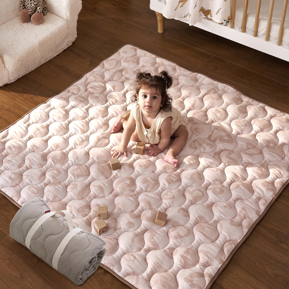 Momcozy Leopard Heart 50x50 baby play mat offers a spacious tummy time area.