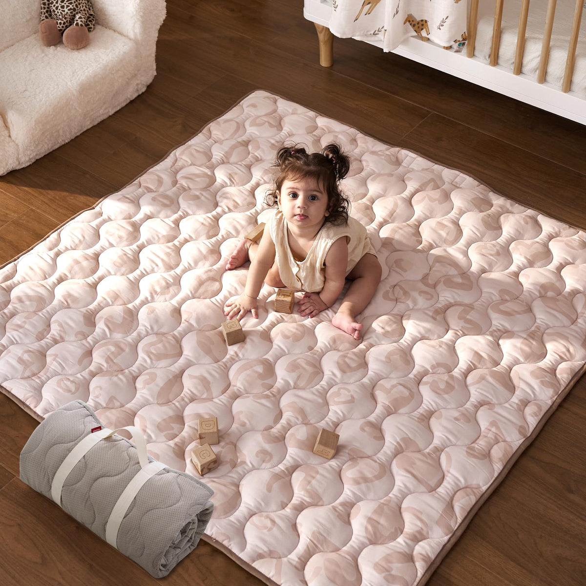 Momcozy Leopard Heart 50x50 baby play mat offers a spacious tummy time area.