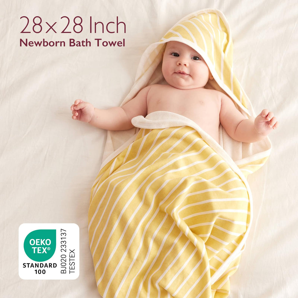 Momcozy 35x35 inch hooded towel covers baby fully for warmth after baths.