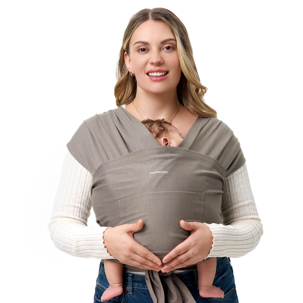 Momcozy Baby Wrap Carrier in brown, front view shows adjustable fit for growing babies and hands-free wear