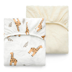 Momcozy Bravery Giraffe crib sheet folded, soft cotton for gentle sleep.