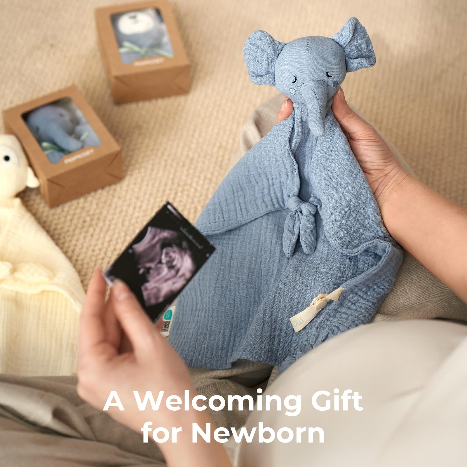 Pacifier loop on Momcozy Elephant Lovey keeps a pacifier handy