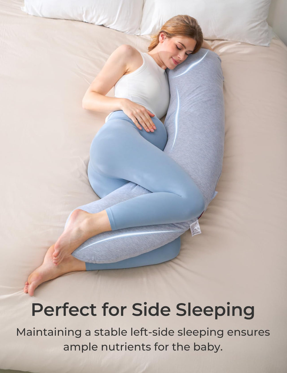 Momcozy ergonomic side-sleep pillow supports head, neck, and belly for comfort.